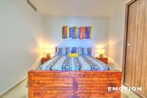 a bedroom with a large wooden bed in a room at Appartement 2 chambres Blue Marine Maho Sxm in Maho Reef