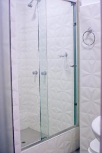 a shower with a glass door in a bathroom at LAS GAVIOTAS DE PARACAS in Paracas +51 photos