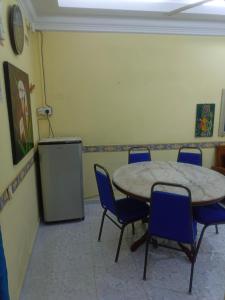 a meeting room with a table and chairs and a podium at MieHomestay Binjai Rendah in Bukit Payong