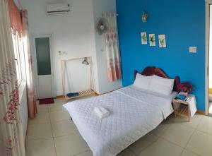 Postel nebo postele na pokoji v ubytování Ly Tri Ly Son Hotel + 13 fotografií