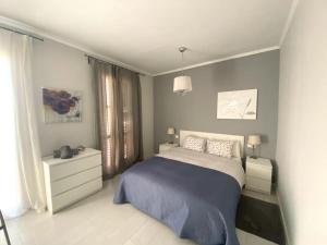 Postel nebo postele na pokoji v ubytování Barcelona Family Beach