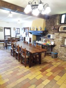 a kitchen and dining room with a wooden table and chairs at All'Ombra di San Damiano ASSISI in Assisi +74 photos