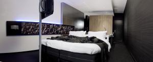 Postel nebo postele na pokoji v ubytování Carbon Hotel