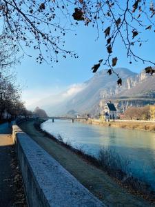 a view of a river with mountains in the background at Casa Daniela in Trento