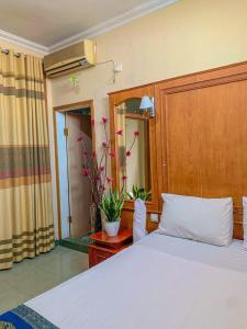 Ένα ή περισσότερα κρεβάτια σε δωμάτιο στο Rumah palala