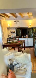 a living room with a table and a couch at At Home in Malaga Stay & Solo Travellers in Rincón de la Victoria