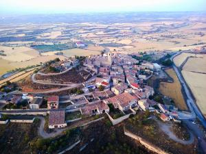an aerial view of a small village with a river at Cal Rei in Grañena de Cervera