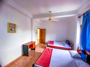 Postel nebo postele na pokoji v ubytování Geesh Residence : Rooms in Jaffna