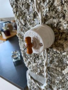a lightswitch on a stone wall at Quinta da Cumieira Nova in Seia