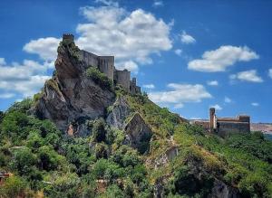 a castle sitting on top of a mountain at Casa vacanza BB degli angeli in Fara San Martino