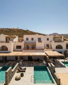 an aerial view of a house with two swimming pools at Villa Lenny in Parikia