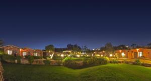 A garden outside Xperience Hill-Top Beach Resort
