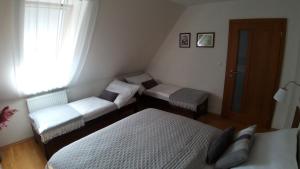 Posteľ alebo postele v izbe v ubytovaní Apartmán AURIS