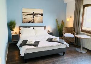 Postel nebo postele na pokoji v ubytování Hotel dat Norden