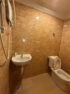 a bathroom with a toilet and a sink at Central KL - Bangsar in Kuala Lumpur