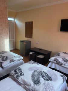 Voodi või voodid majutusasutuse Zangu Hotel toas