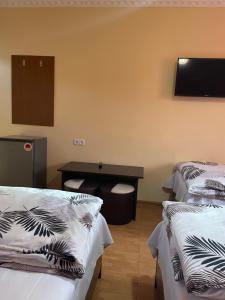 Voodi või voodid majutusasutuse Zangu Hotel toas