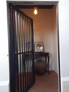 an open door to a room with a table at Villanueva House in Liliw +12 photos
