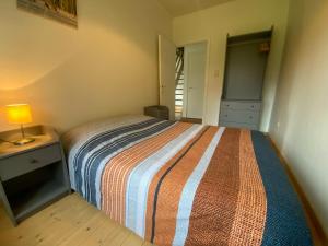 Postel nebo postele na pokoji v ubytování Vakantiewoning Heidebos in het Nationaal Park Hoge Kempen