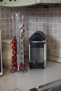 a toaster and a container on a kitchen counter at 6th DOOR HOUSE in Pisa +18 photos