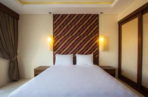 Voodi või voodid majutusasutuse M Suite Bali toas