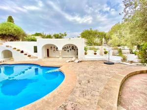 a house with a swimming pool in a yard at Lella Khadija B&B Sidi bou said in Tunis