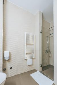 a bathroom with a shower and a toilet at Apartments Kuce Lekovica Beach & snack bar- Bistro in Bar