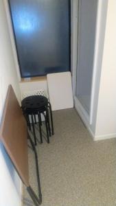 a small room with a stool and a window at Hananogo Ikebukuro - Vacation STAY 16098v in Tokyo
