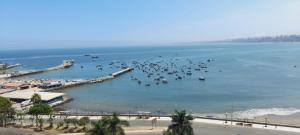 a view of a harbor with boats in the water at HOSPEDAJE TURISTICO CHORRILLOS Sueños de Luna INN in Lima +24 photos