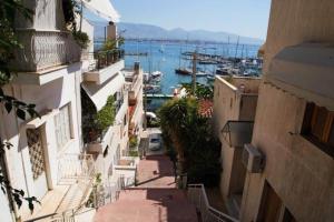 an alleyway between two buildings with a harbor at Lovely,central, spacious 2-bedrooms apartment in Piraeus