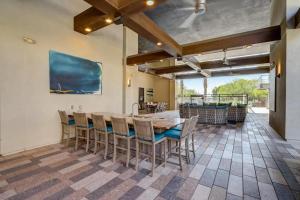 a dining room with a large table and chairs at Modern 2BR CozySuites on Town Lake waterfront 12 in Tempe