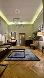 a living room with a coffee table and a couch at 4m high apartment in heart of Warsaw! in Warsaw
