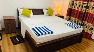 Postel nebo postele na pokoji v ubytování Tamaro Beach Resort
