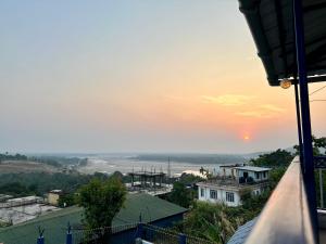 a view of the sunset from a house at The Dawki View Guest House in Dawki