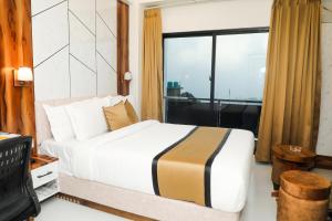 Кровать или кровати в номере Accom Hotel
