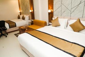 Кровать или кровати в номере Accom Hotel