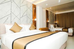 Кровать или кровати в номере Accom Hotel