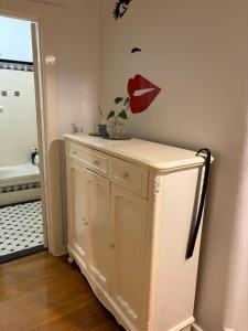 a refrigerator in a room with a face on the wall at Clarence Gardens in Colonel Light Gardens