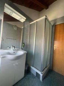 a bathroom with a sink and a shower at Villa Sunce in Jezera +51 photos