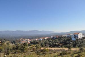 a small town on a hill with houses at Casa rural rio yeguas in Azuel