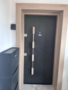a glass door with two wooden sticks on it at WE3 Jesewitz in Jesewitz
