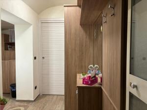 a hallway with a bathroom with a wooden wall at MareLuna Guest House in Naples