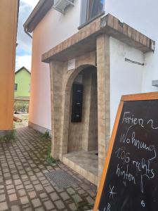 a sign in front of a building with a door at WE3 Jesewitz in Jesewitz