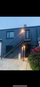 a building with a staircase on the side of it at Blaue 8 -2 in Leezen