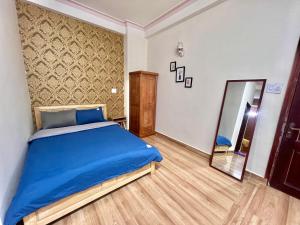 Postel nebo postele na pokoji v ubytování Nấm Home
