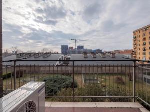 a view of a city from a balcony at [IHost Flat] - Giambellino 131-2 in Milan