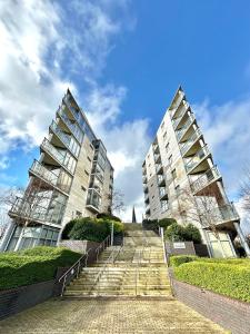 two tall buildings with stairs in front of them at Modern 2Bedroom Oasis near Dublin city centre & Airport in Dublin