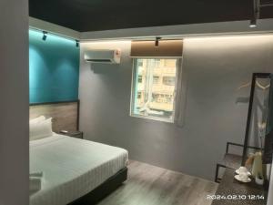 Postel nebo postele na pokoji v ubytování Pantai Inn Kota Kinabalu