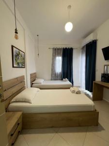 Postel nebo postele na pokoji v ubytování Hotel Apostoli