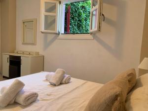 Postel nebo postele na pokoji v ubytování Pandora Villa